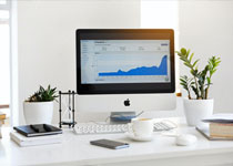 A desktop computer showing financial software